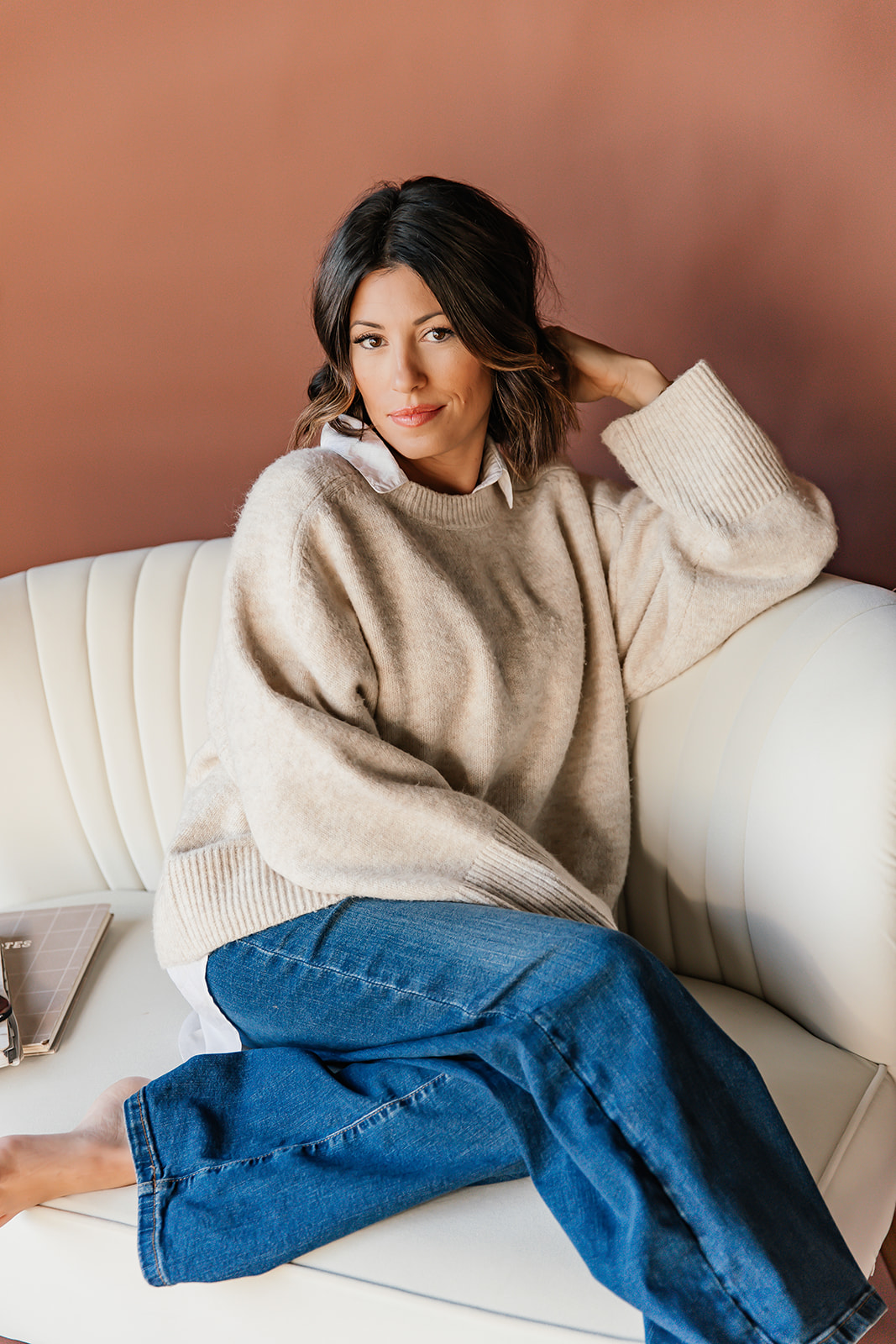 Lindsey relaxing on a couch
